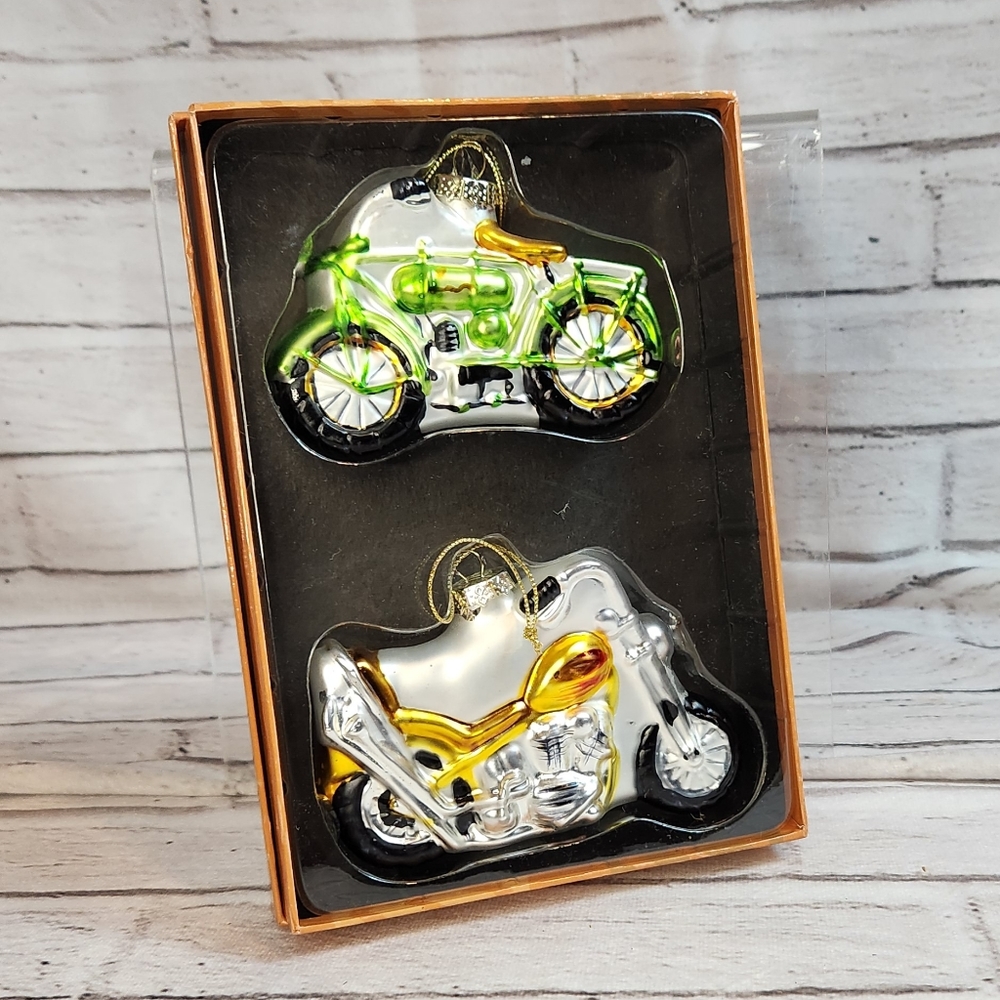 A pair of Glass motorcycle ornaments